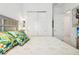 Bright bedroom with a queen bed and tropical accents at 1029 Seagrape Dr, Ruskin, FL 33570