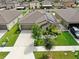 Single-Gathering home with solar panels and landscaped yard at 15407 Miller Creek Dr, Sun City Center, FL 33573