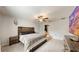 Main bedroom with king bed, ensuite bathroom access, and TV at 15407 Miller Creek Dr, Sun City Center, FL 33573