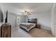 Spacious bedroom with a king-size bed and ceiling fan at 15407 Miller Creek Dr, Sun City Center, FL 33573
