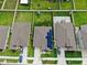 Aerial view showcasing a neighborhood with houses and lush green spaces at 15407 Miller Creek Dr, Sun City Center, FL 33573