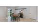 Cozy dining area with a round table and four chairs, near sliding door at 15407 Miller Creek Dr, Sun City Center, FL 33573