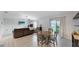 Living room with dining area and access to the backyard at 15407 Miller Creek Dr, Sun City Center, FL 33573