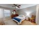 Cozy bedroom with a double bed and ceiling fan at 3866 37Th S St # 47, St Petersburg, FL 33711