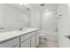 Bright bathroom featuring a vanity with white countertop and subway tile shower at 4285 Big Sky Dr, Spring Hill, FL 34604
