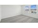 Bright bedroom featuring plush carpet and two bright windows at 4285 Big Sky Dr, Spring Hill, FL 34604