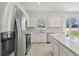 Bright kitchen features stainless steel appliances, granite countertops and ample cabinet space at 4285 Big Sky Dr, Spring Hill, FL 34604