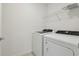 Efficient laundry room featuring a washer and dryer at 4285 Big Sky Dr, Spring Hill, FL 34604