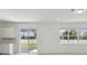 Living room with view to the backyard and sliding glass doors at 4285 Big Sky Dr, Spring Hill, FL 34604