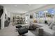 Open-concept living area flows into kitchen with natural light and modern furnishings at 4285 Big Sky Dr, Spring Hill, FL 34604