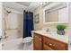 Clean bathroom with shower/tub combo and wood vanity at 5575 Gulf Blvd # 438, St Pete Beach, FL 33706