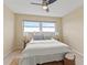 Bright bedroom with a comfortable bed and ceiling fan at 5575 Gulf Blvd # 438, St Pete Beach, FL 33706