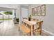 Bright dining area featuring a wooden table and bench at 817 Horizon Way, Clearwater, FL 33765