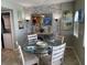 Charming dining area with seating for four and decorative wall at 445 Hamden Dr # 505, Clearwater Beach, FL 33767
