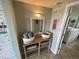 Bright bathroom entry with mirror and storage at 445 Hamden Dr # 505, Clearwater Beach, FL 33767