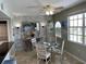 Bright dining area with glass-top table and seating for four at 445 Hamden Dr # 505, Clearwater Beach, FL 33767