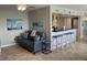 Relaxing living room with a gray couch and bar area at 445 Hamden Dr # 505, Clearwater Beach, FL 33767