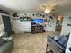 Living room with coastal decor and view to the kitchen at 445 Hamden Dr # 505, Clearwater Beach, FL 33767