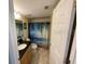 Clean bathroom with a shower/tub combo and granite countertop at 445 Hamden Dr # 505, Clearwater Beach, FL 33767