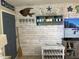 Beach-themed wall and decor in living room at 445 Hamden Dr # 505, Clearwater Beach, FL 33767