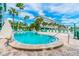 Community pool with lounge chairs at 445 Hamden Dr # 505, Clearwater Beach, FL 33767