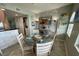 Dining area with a round glass table and stone feature wall at 445 Hamden Dr # 505, Clearwater Beach, FL 33767