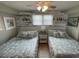 Comfortable bedroom with two queen beds and nightstands at 445 Hamden Dr # 505, Clearwater Beach, FL 33767