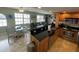 Modern kitchen with stainless steel appliances and breakfast bar at 445 Hamden Dr # 505, Clearwater Beach, FL 33767