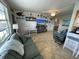 Bright living room featuring tiled floors and coastal decor at 445 Hamden Dr # 505, Clearwater Beach, FL 33767