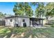 Backyard view of house with screened porch at 4428 W Wyoming Ave, Tampa, FL 33616