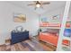 Cozy bedroom with bunk beds, dresser, and light wood flooring at 13769 Old Creek Ct, Parrish, FL 34219