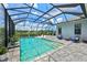 Enjoy this refreshing pool with a screened enclosure and comfortable seating at 13769 Old Creek Ct, Parrish, FL 34219