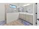Bathroom with double vanity, large mirror, and walk-in shower at 13769 Old Creek Ct, Parrish, FL 34219