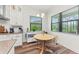 Kitchen breakfast nook with wood table and chairs, offering a casual dining space at 13769 Old Creek Ct, Parrish, FL 34219