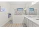 Bright bathroom with double vanity, walk-in shower, and tile flooring at 13769 Old Creek Ct, Parrish, FL 34219