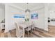 Dining room with a rustic table and chairs, adjacent to kitchen at 13769 Old Creek Ct, Parrish, FL 34219