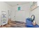 Charming bedroom with a dresser, shelving unit, and wood flooring at 13769 Old Creek Ct, Parrish, FL 34219