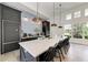 Modern community kitchen with breakfast bar and counter seating at 13769 Old Creek Ct, Parrish, FL 34219