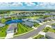 Community overview showcasing lakefront homes and landscaping at 13769 Old Creek Ct, Parrish, FL 34219