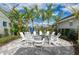 Cozy fire pit area with white rocking chairs at 13769 Old Creek Ct, Parrish, FL 34219