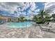 Community pool with surrounding lounge chairs at 13769 Old Creek Ct, Parrish, FL 34219