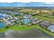 Community overview featuring pool, tennis courts, and lake at 13769 Old Creek Ct, Parrish, FL 34219