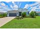 Two-story house with gray siding and landscaping at 13769 Old Creek Ct, Parrish, FL 34219