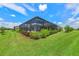 Inviting pool area with lush landscaping and screened enclosure at 13769 Old Creek Ct, Parrish, FL 34219