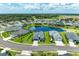 Community overview showcasing lakefront homes and landscaping at 13769 Old Creek Ct, Parrish, FL 34219