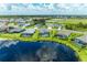 Community overview showcasing lakefront homes and landscaping at 13769 Old Creek Ct, Parrish, FL 34219
