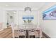 Farmhouse-style dining room with a wooden table and six chairs at 13769 Old Creek Ct, Parrish, FL 34219