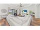 Spacious living room with sectional sofa and view of backyard at 13769 Old Creek Ct, Parrish, FL 34219