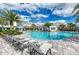 Inviting pool area with lounge chairs and palm trees at 13769 Old Creek Ct, Parrish, FL 34219