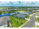 Aerial view of a luxury community with lake, pool, and upscale homes at 13769 Old Creek Ct, Parrish, FL 34219